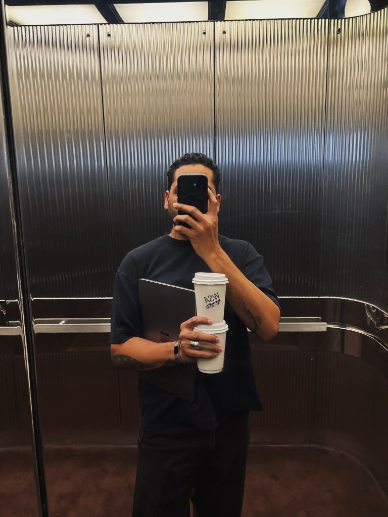 MONTES creative portrait holding coffee in NYC